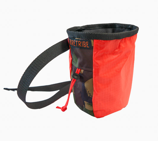 Chalk bag, made from salvaged Tents. With sides made from salvaged pink deadstock fabric. With woven a Retribe badge on the side. Black webbing waist strap.